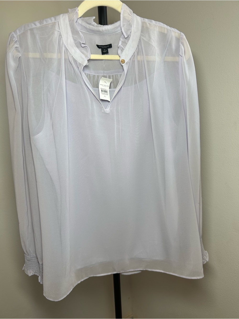 Ann Taylor a sheer, lightweight soft lilac blouse, long sleeves, smocked cuffs.